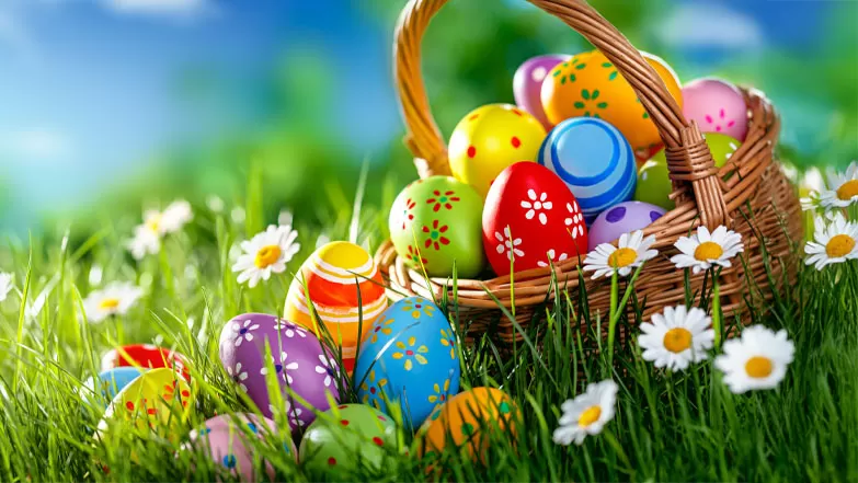 Basket of Easter Eggs in lush green grass